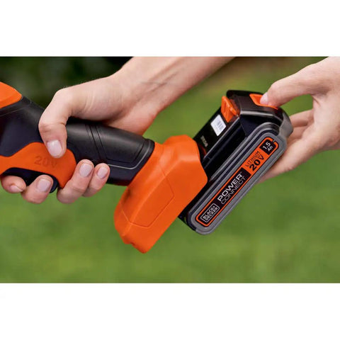 Inserting 20V battery into Lightweight Cordless Hedge Shear Kit With Three Eighth Inch Cut, Interchangeable Four And Eight Inch Blades