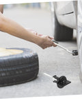 Replacement Tire Bolt And Hold Down Clamp For Car Wheels Durable Steel Retainer in use during tire change on vehicle