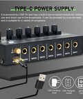 Six Channel Mini Audio Mixer For Live Gigs And Home Studios With Ultra Low Noise And Independent Microphone Control One Quarter Inch TRS Input And Output Great For Guitars Bass Sub Mixing And Stage Use showing rear panel with Type-C power supply inputs and outputs.