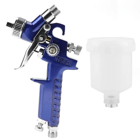 Pro Grade Mini Pneumatic Spray Gun With Swappable 0.8 And 1.0 Mm Tips For Car Repair Wall Refresh And Craft Builds Delivers A Sick Finish Every Single Time, showing blue HVLP spray gun with clear fluid container.