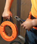 Top Shelf 13 Inch Flexible Fish Tape Leader For 1/8 Inch Steel Tapes shown in use with pliers, ideal for wiring tasks.