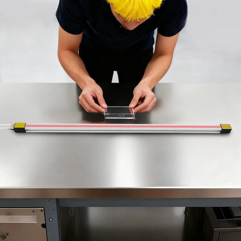 Person adjusting acrylic sheet on a Big 49 Inch Acrylic Heat Bending Machine 1500W Plastic Bender for thermoforming projects.