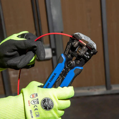 Self-Adjusting Wire Stripper And Cutter, Heavy Duty, Cuts And Strips 10-20 AWG Solid And 12-22 AWG Stranded in use on red wire