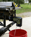 Table Saw Dust Collection Adapter With Snap On Dust Port, Tool Free Installation, Easy Hook On Fit, Efficient Sawdust Capture Up To Ninety Percent, Cleaner And Safer Workshop, Quick Setup, Black Finish, attached to a table saw outdoors.