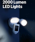 Floodlight Pro Security Camera With Retinal 2K Video Color Night Vision Two Way Talk And Audio 3D Motion Detection Built In 110 dB Siren Perfect For Home Or Biz Outdoor Security mounted on wall with LED lights glowing.