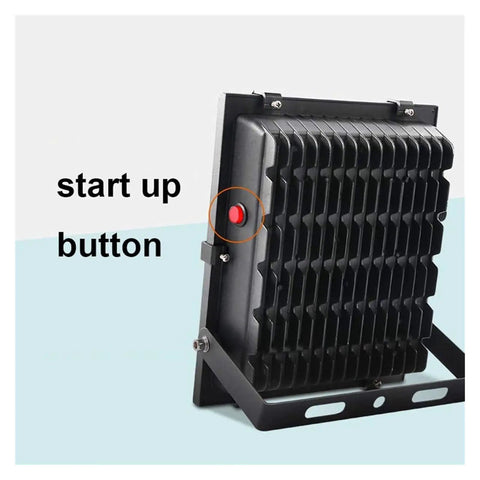 Close-up of Super Bright Solar Led Flood Light with start up button and metal mount, ideal for outdoor security usage.