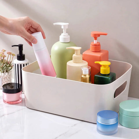 Gray White Plastic Storage Bins With Reinforced Handles For Home Organization And Closet Pantry Use Stackable Small Containers holding various bottles.