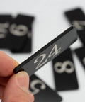 Close-up of black acrylic rectangle locker number sticker 24, 2.36 x 0.98 inch, waterproof, from Plastic Locker Number Stickers 51 To 100