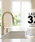 Modern Champagne Gold Kitchen Faucet With Pull Down Sprayer And Dual Function Head, Single Hole Brass Build showcased beside sink.