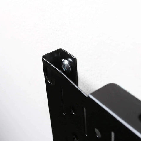 Close-up of black metal panel from Modular Black Pegboard Wall Organizer Tiles Set Four 12 Inch Tall By 16 Inch Wide Metal Pegboard Panels
