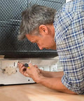Man using Top Notch T20 Security Torx Screwdriver With Strong Magnetic Tip Heavy Duty Drop Forged Steel for appliance repair.