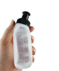 Hand holding a Two Pack 6oz Running Water Bottle For Hydration Belts And Waist Packs with black sip lid, durable plastic design