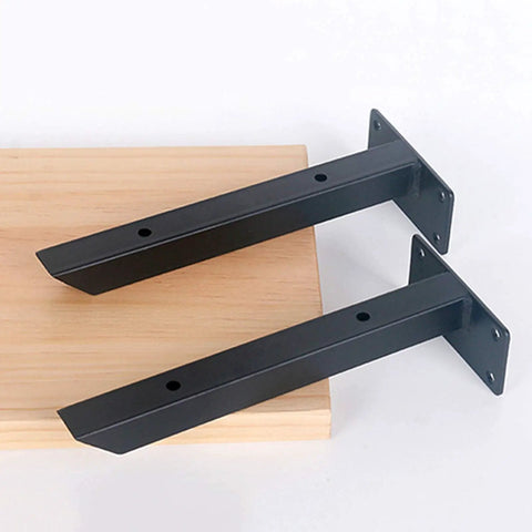 Rock Solid Wall Mounted Shelf Brackets Pack Of Two Heavy Duty Metal Supports Black Steel Finish 12 Inch Arms on wood plank.