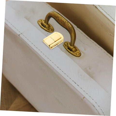 Retro Toggle Lock Latch Hardware 5pc Set on white suitcase, zinc alloy secure closure kit for storage and travel gear
