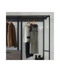 Top Shelf Wood Walk In Closet Organizer System Featuring Straight Up Customizable Shelves Heavy Duty Hanging Rods And Hassle Free Drawers For Bedroom Storage That Honestly Maximizes Space, showcasing hanging clothes on a metal rod.