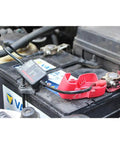 Heavy Duty Wireless Battery Monitor Smart Tester With Bluetooth For Lead Acid Packs connected to a truck battery, showing compact design and setup.