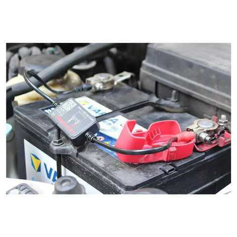 Heavy Duty Wireless Battery Monitor Smart Tester With Bluetooth For Lead Acid Packs connected to a truck battery, showing compact design and setup.