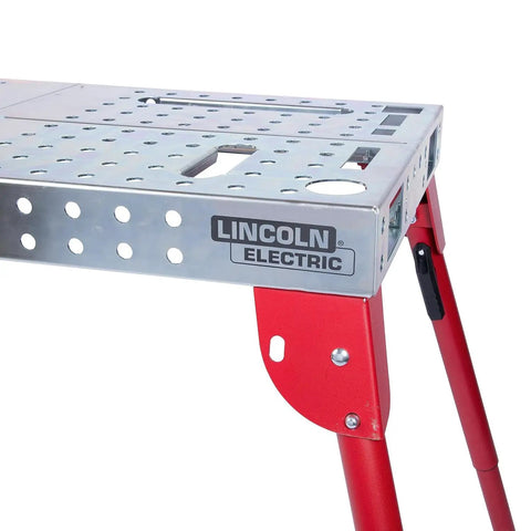 Heavy Hitter Portable Welding Table Folding Workbench 21 X 44 Inches flat steel surface with red locking legs.