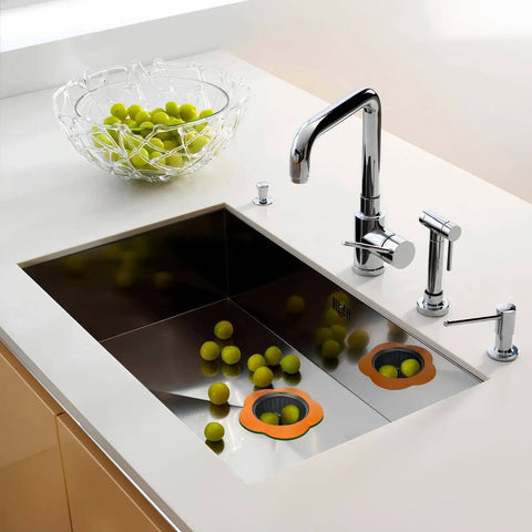 Colorful Silicone Kitchen Sink Strainers Set Of 4 With Large 4.5 Inch Wide Rim in a modern kitchen sink, catching debris.