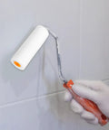 Straight Up Quality Mini Sponge Paint Roller Covers on a standard roller handle painting a wall.
