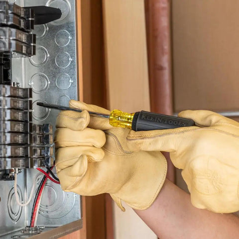 4 Piece Square Recess Screwdriver Set With Color Coded Handles Heat Treated Chrome Plated Shafts Cushioned Grip in use on panel