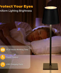 Black Cordless LED Desk Lamp With 5000mAh Battery beside sleeping man in bedroom for cordless lighting