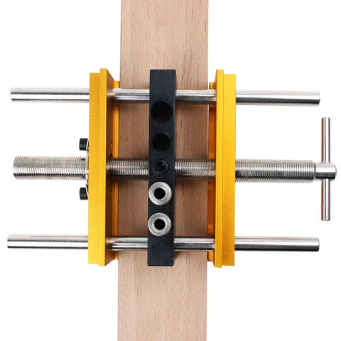 Self Centering Doweling Jig Kit For 6 Inch Dowel Jig With 6 Drill Guide Bushings clamped on wood for precise holes