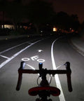 Cyclist perspective with Lumina 1000 Boost Front Bike Light With Sabre 110 illuminating bike lane at night