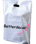 White plastic bag with handle, brand name 'Betterdecor' in black, and pink stars decoration.