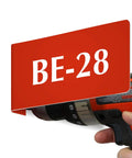 Heavy Duty Horizontal Warehouse Aisle Signs Custom Engraved L Shaped Rack Markers With Kickass Durable ABS Plastic Build Pre Drilled Mounting Holes Ready To Hang Made In Usa showing red BE-28 sign with drill.