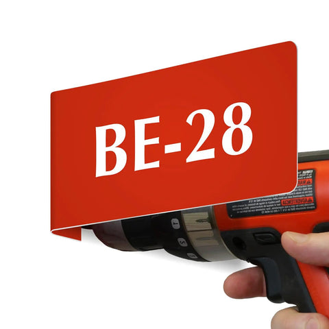 Heavy Duty Horizontal Warehouse Aisle Signs Custom Engraved L Shaped Rack Markers With Kickass Durable ABS Plastic Build Pre Drilled Mounting Holes Ready To Hang Made In Usa showing red BE-28 sign with drill.