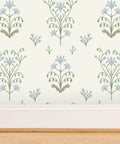 Premium Floral Meadow Wallcovering With A Subtle Matte Linen Texture Hits Different Across Every Room Built Tough For Busy Households Featuring No Sweat Paste To Paper Install showing blue floral pattern on light background.
