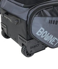 Close-up of wheels and logo on Commander Catchers Gear Bag With Wheels For Travel And Outdoor Play Black Rugged Durable Equipment Carrier