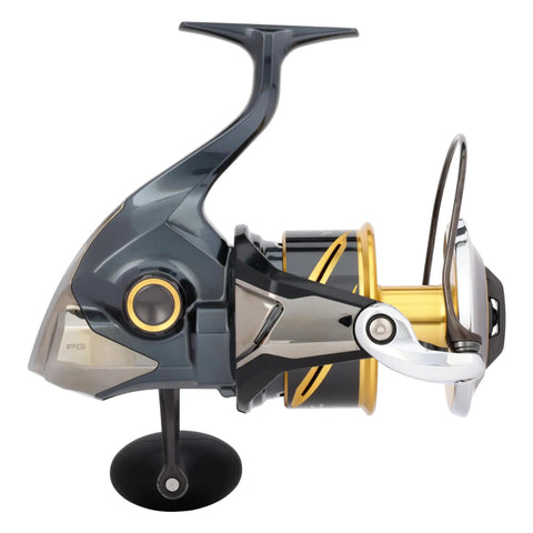 Side view of Stella SW D Spinning Reels With XX Tough Drag Technology for saltwater fishing, featuring gold spool and robust frame.