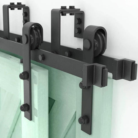 Close-up of double track system for Bypass Sliding Barn Door Hardware Kit, 16 Ft Four Doors, installed on a stud wall.
