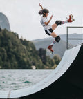 Skater performing jump on ramp, using Rock Solids Roller Skate Bearings 16 Pack For Quad Skates ABEC 9 Pro Grade 8mm
