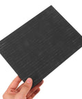 Hand holding Heavy Duty High Purity Graphite Pad Plate 200 By 150 By 2.5 Mm For Smelting And Electrode Supplies Industrial Grade Ingot Pad.