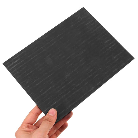Hand holding Heavy Duty High Purity Graphite Pad Plate 200 By 150 By 2.5 Mm For Smelting And Electrode Supplies Industrial Grade Ingot Pad.