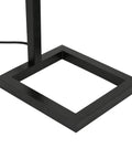Base of 68 Inch Tall Floor Lamp With White Fabric Drum Shade In Blackened Bronze Finish Delivers Cozy Ambient Lighting For Relaxing Evenings