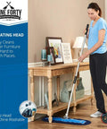 Badass Heavy Duty 24 Inch Nylon Dust Mop Head For Hardwood Floors Machine Washable Commercial Sweeper being used to clean under furniture.