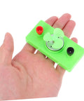Mini Solar Powered DC Motor For Science Experiments And Hands On DIY Projects in a hand, green plastic housing, small size