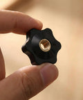 Top Shelf Set 20 Piece Slick Star Knob T Track Bolts With Quarter Inch Female Thread Hexagon Head For Woodworking Jigs Lawnmowers And Patio Umbrellas Easy Grip Solid Clamp Hardware In Matte Black held in hand.