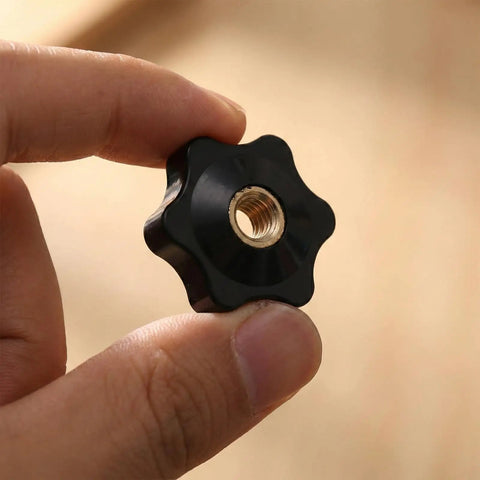 Top Shelf Set 20 Piece Slick Star Knob T Track Bolts With Quarter Inch Female Thread Hexagon Head For Woodworking Jigs Lawnmowers And Patio Umbrellas Easy Grip Solid Clamp Hardware In Matte Black held in hand.