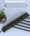 Flat Plug Dope Surge Protector With 5 Outlets, 2 USB A Ports And 1 USB C Port, 10 Ft Braided Extension Cord, top view with plant