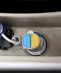 Inside view of a toilet tank showing a Two Inch Toilet Flush Valve Assembly For Most One Piece Toilets With Top Push Button Universal Fit