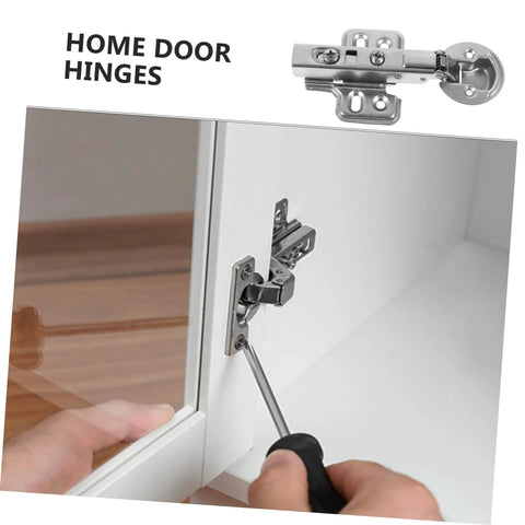 Two stainless steel cabinet door hinges with hydraulic buffer, installed on white kitchen cabinet.
