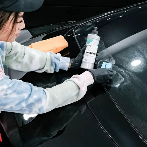 CeriGlass Glass Polish And Cleaner Compound For Auto Glass Restoration 500ml 17oz Removes Swirls Light Scratches Water Spots Tiny Pits And Wiper Grime With Dual Action Machine For Crystal Clear Windshield. Technician polishing black car windshield with 500ml bottle and pad