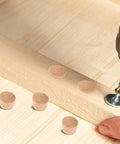 Natural Wood Screw Hole Plugs For Beehives And DIY Projects, drill and plugs on wood surface