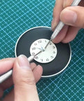 Using 6 In 1 Watch Hands Repair Kit With 3 Hand Pressers And 2 Removers on wristwatch dial for precise hand setting
