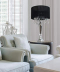 Trendy Romantic Sheer Shade Hanging Crystals Table Lamp In Black With Chrome Finish on side table in living room